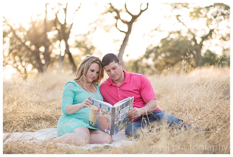 maternity couple reading baby book